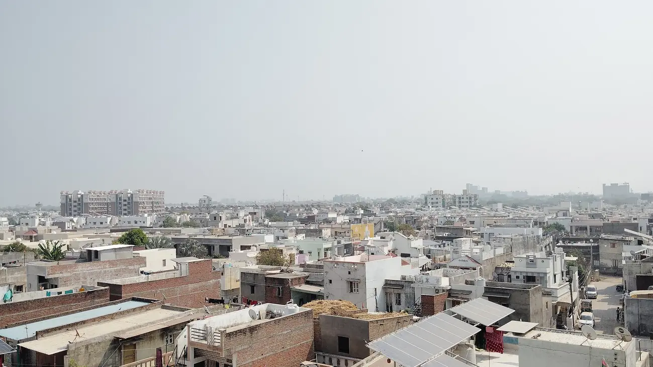 Rooftop Solar panels on homes in Mehsana, Gujarat, India.jpg