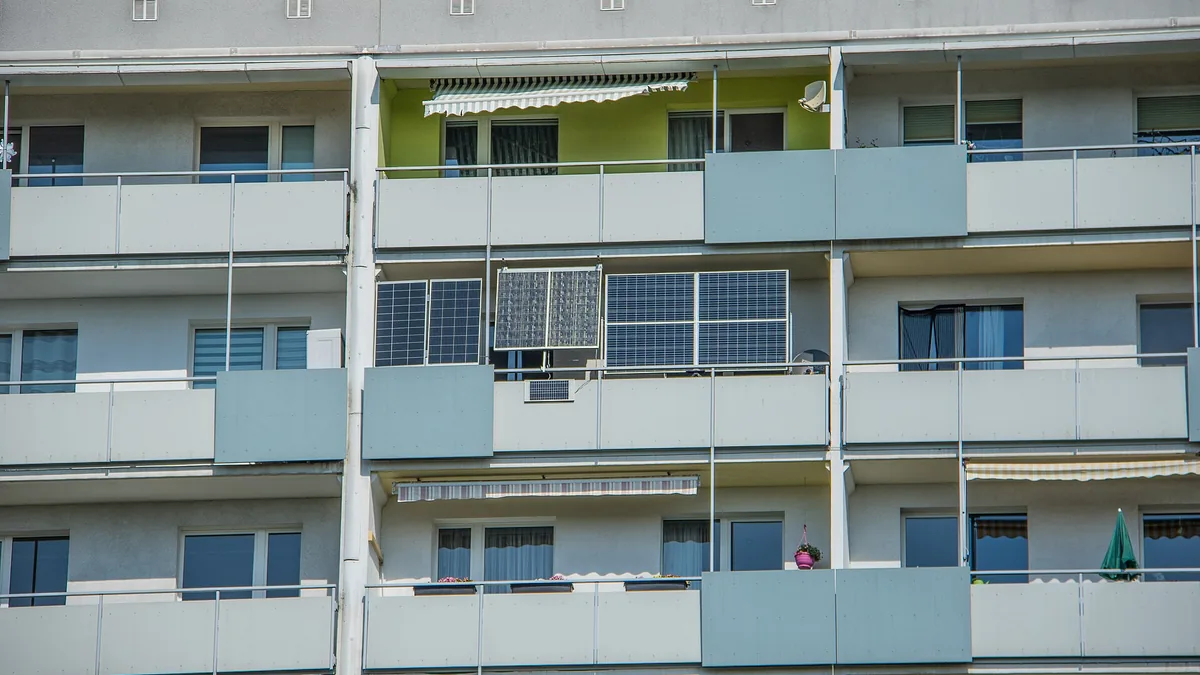 Balcony solar modules mounted on the facade of an apartment building