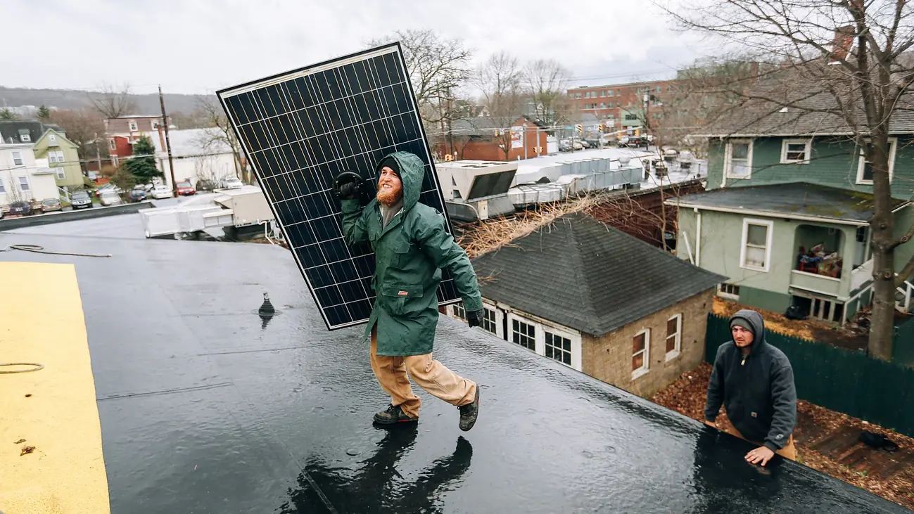 Technicians working on a solar panel installation (9236).jpg