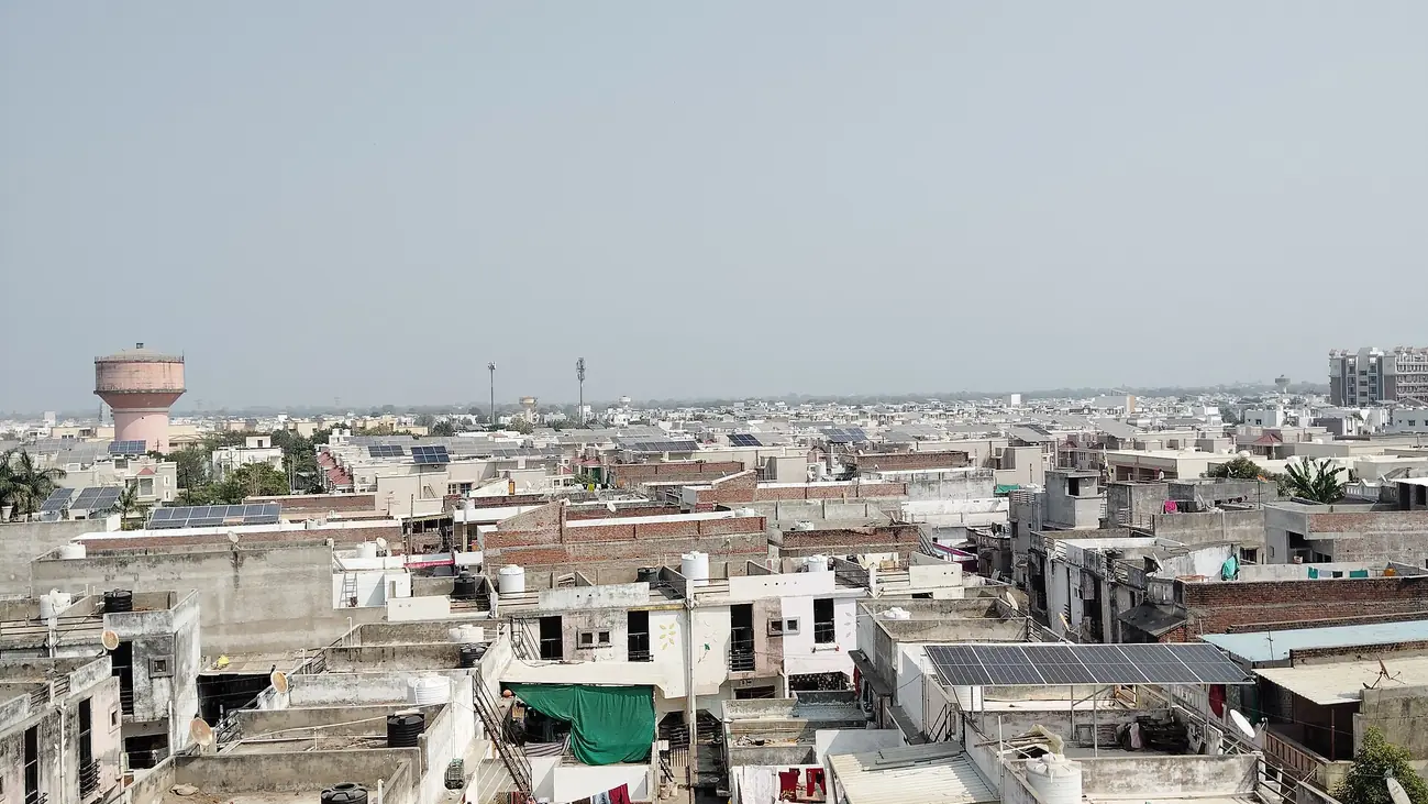 Rooftop Solar panels on homes in Mehsana, Gujarat, India (30891).jpg