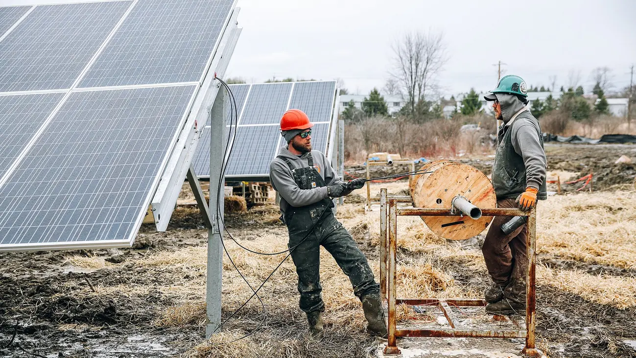 Technicians working on a solar panel installation (9229).jpg